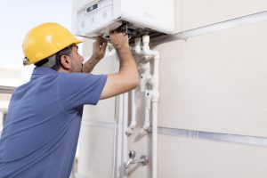 technician-working-on-gas-powered-boiler