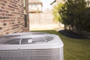 air-conditioner-next-to-brick-house